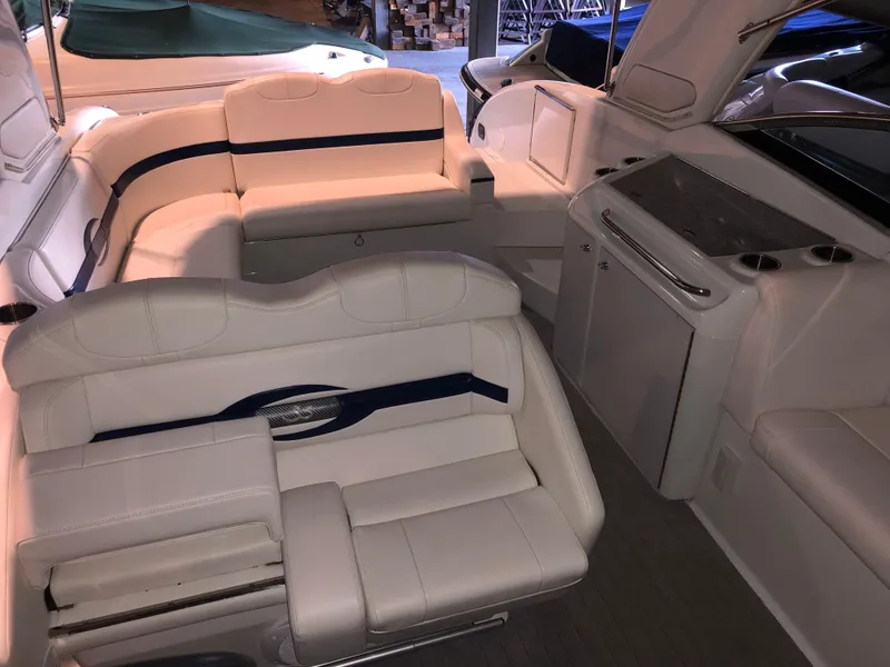 Slide: The Image of 2008 Formula 310 Sun Sport boat interior with white seating and sleek design. - 6