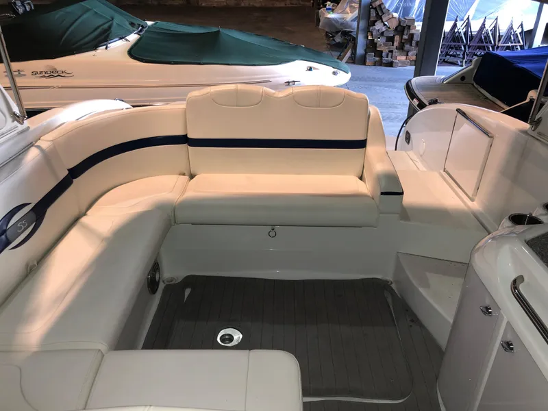 Slide: The Image of 2008 Formula 310 Sun Sport boat interior with white seating and sleek design. - 7
