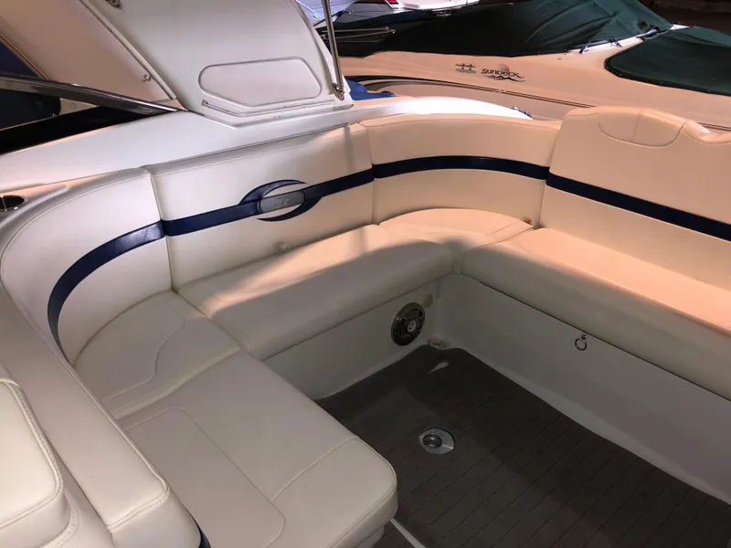 Slide: The Image of 2008 Formula 310 Sun Sport boat interior with white and blue seating. - 8