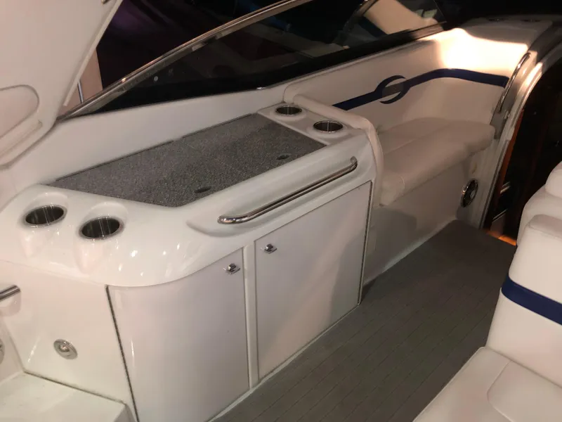 Slide: The Image of 2008 Formula 310 Sun Sport boat interior with seating and storage. - 9