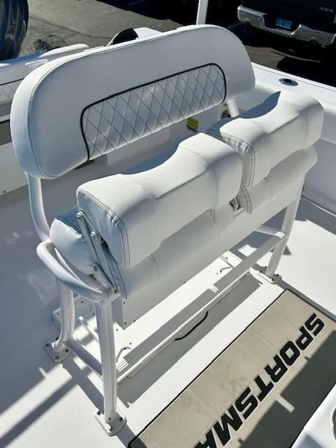 Slide: The Image of 2024 Sportsman Open 232 Center Console boat seating with white cushioned design. - 10