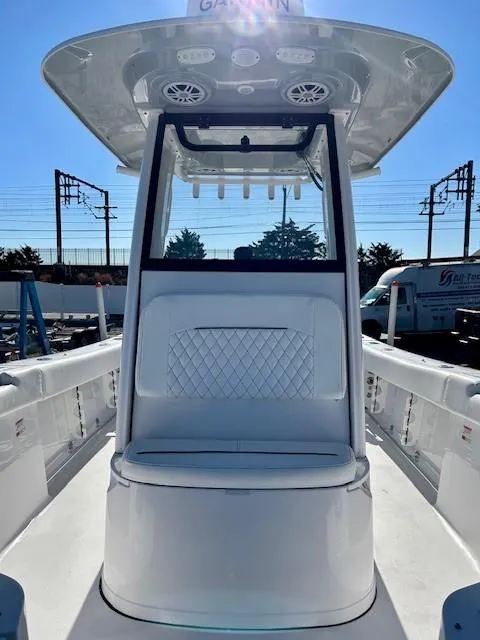 Slide: The Image of 2024 Sportsman Open 232 Center Console boat, featuring sleek design and spacious seating. - 13