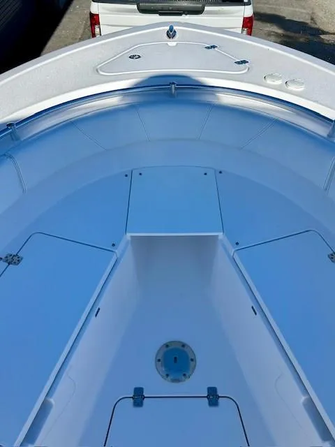 Slide: The Image of 2024 Sportsman Open 232 Center Console boat interior, featuring spacious storage compartments. - 15