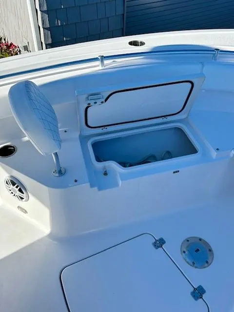 Slide: The Image of 2024 Sportsman Open 232 Center Console boat with open storage compartment. - 16