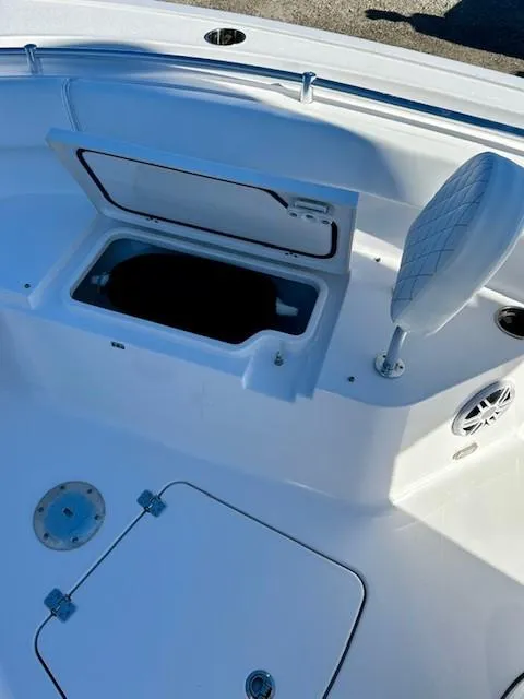 Slide: The Image of 2024 Sportsman Open 232 Center Console boat interior storage compartment. - 17