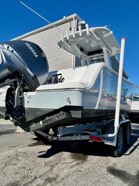 Slide: The Image of 2024 Sportsman Open 232 Center Console boat on trailer, featuring Yamaha outboard motor. - 6