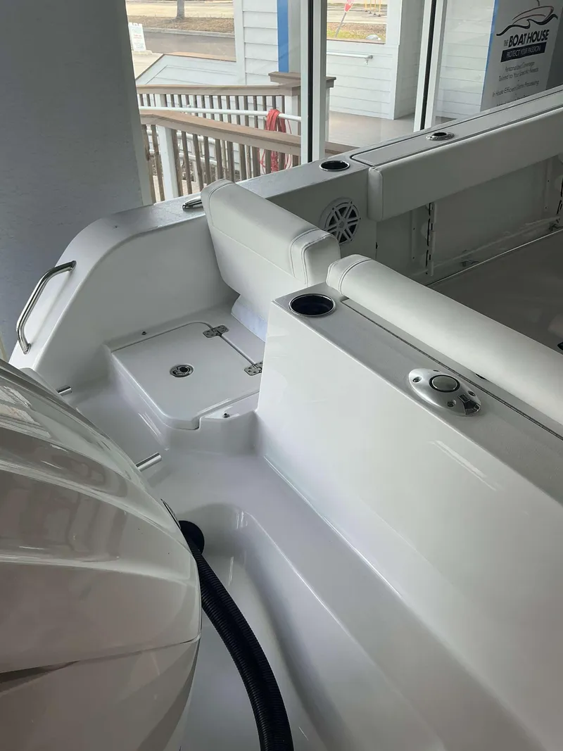 Slide: The Image of 2025 Sportsman 231 Heritage boat interior with seating and storage compartments. - 11