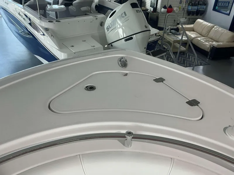 Slide: The Image of 2025 Sportsman 231 Heritage boat interior with Suzuki engine in showroom. - 17