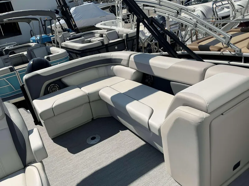Slide: The Image of 2025 Sweetwater 2286 C pontoon boat with spacious seating and modern design. - 17