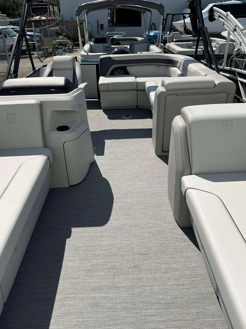 Slide: The Image of 2025 Sweetwater 2286 C pontoon boat interior with spacious seating and modern design. - 5