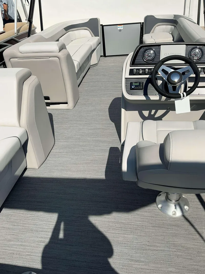 Slide: The Image of Interior of 2025 Sweetwater 2286 C boat with modern seating and steering console. - 6