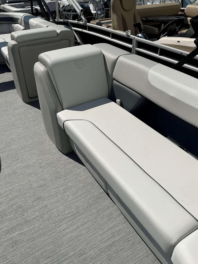 Slide: The Image of 2025 Sweetwater 2286 C boat interior with plush seating and modern design. - 9