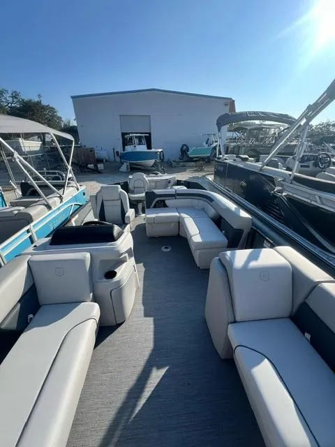 Slide: The Image of 2025 Sweetwater 2286 FS pontoon boat with spacious seating and modern design. - 3