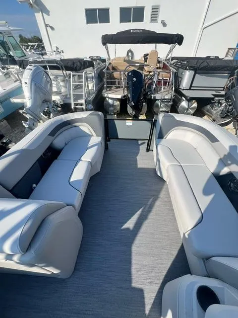 Slide: The Image of 2025 Sweetwater 2286 FS boat interior with plush seating and modern design. - 4