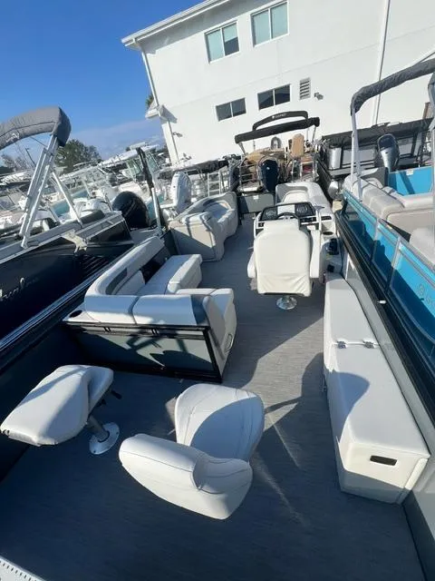 Slide: The Image of 2025 Sweetwater 2286 FS pontoon boat with spacious seating and modern design. - 8