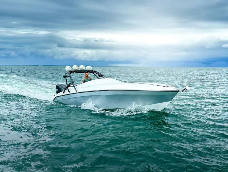 The Image of 2014 Pronautica 33 Sport 1000 cruising on open water under cloudy skies. - 0