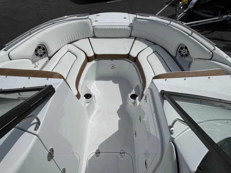Slide: The Image of 2025 Stingray 231 DC boat interior with white seating and speakers. - 14