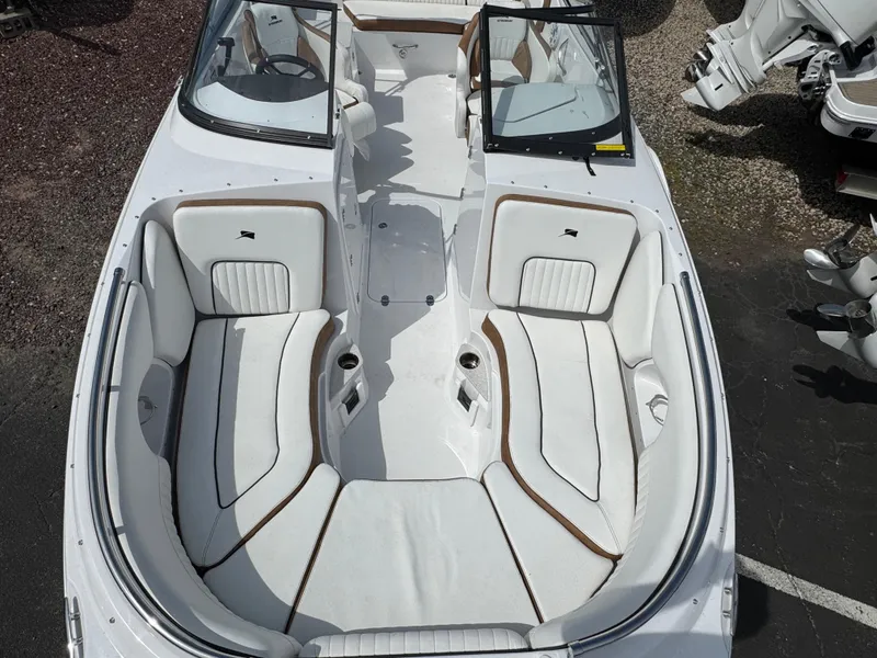 Slide: The Image of 2025 Stingray 231 DC boat interior with white seating and open cockpit design. - 18