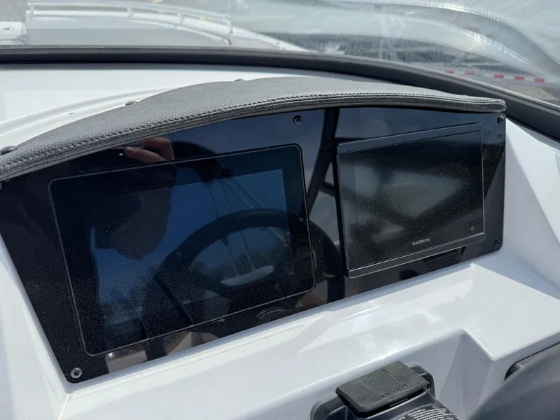 Slide: The Image of Dashboard of 2025 Stingray 231 DC boat with dual display screens. - 8