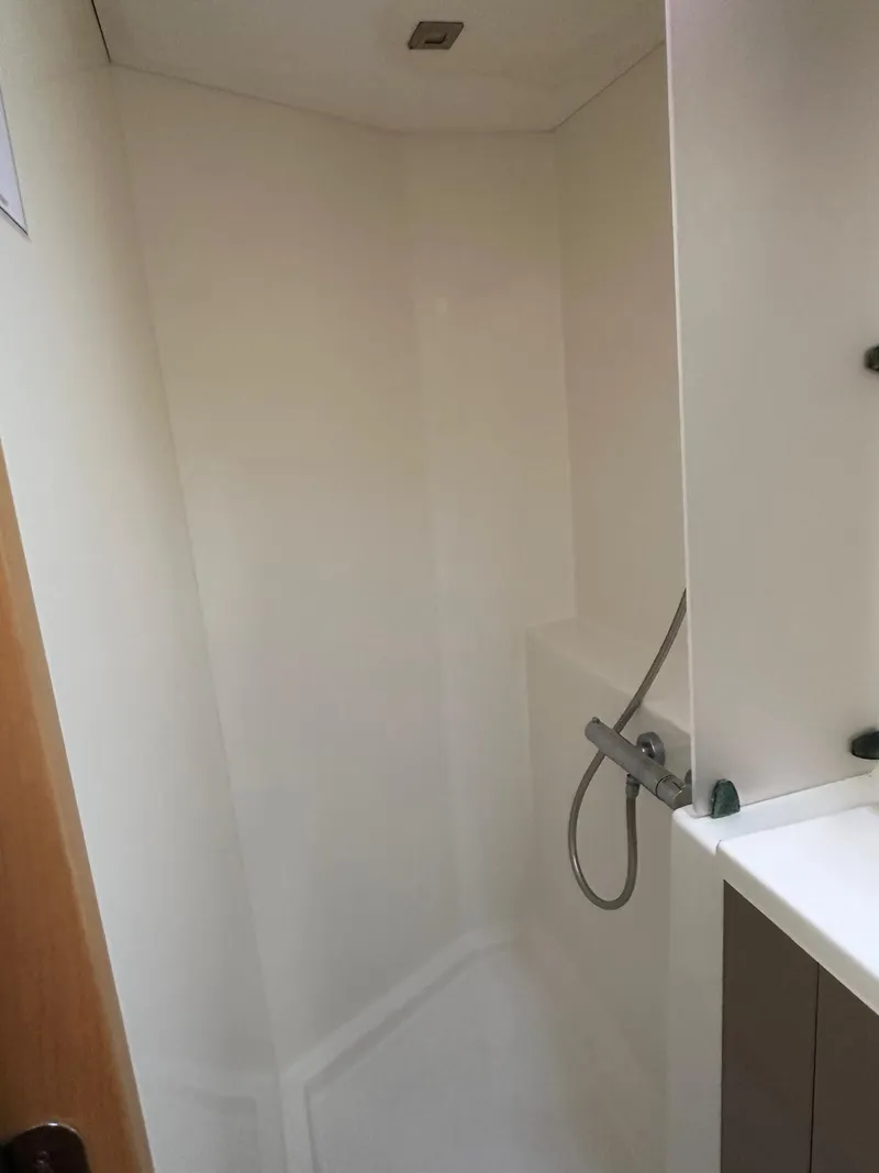 Slide: The Image of Shower area in 2019 Fountaine Pajot Lucia 40 catamaran, featuring modern fixtures. - 23