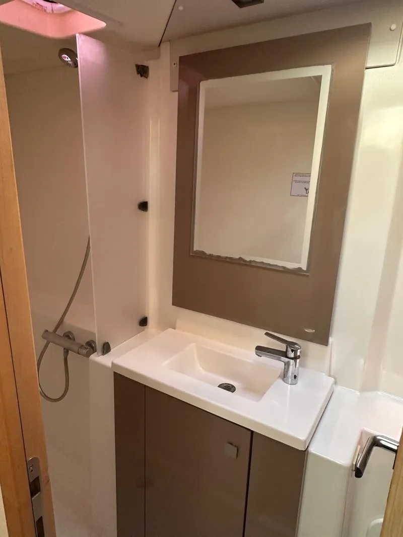 Slide: The Image of Modern bathroom in 2019 Fountaine Pajot Lucia 40 catamaran with sink, mirror, and shower. - 24