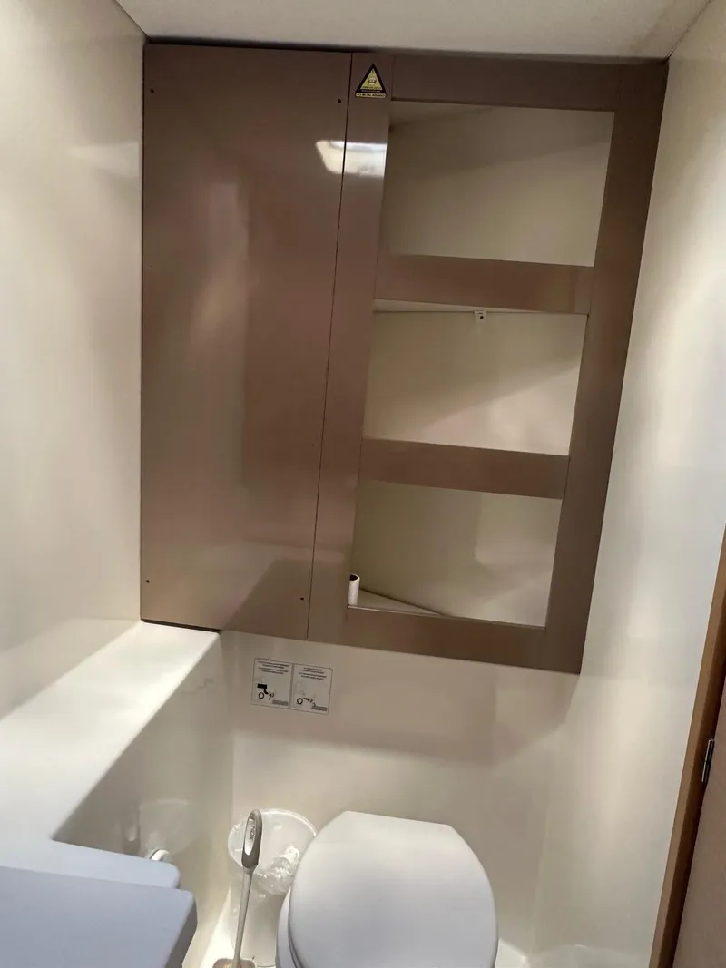 Slide: The Image of 2019 Fountaine Pajot Lucia 40 yacht bathroom with modern fixtures and storage. - 25