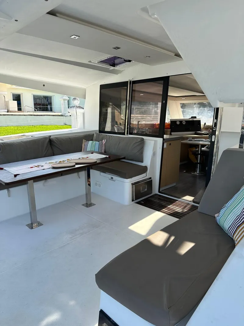 Slide: The Image of 2019 Fountaine Pajot Lucia 40 catamaran interior with spacious seating and dining area. - 31