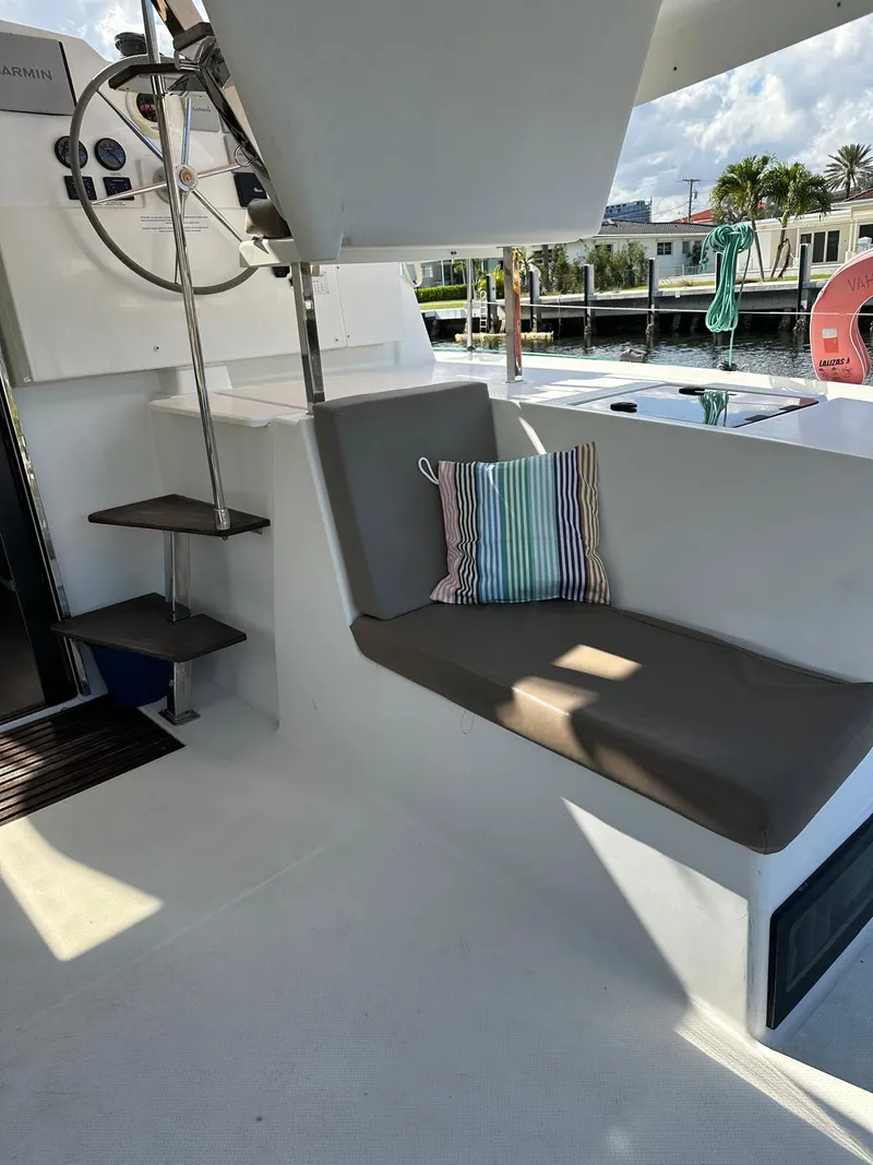Slide: The Image of 2019 Fountaine Pajot Lucia 40 yacht interior with seating and steering wheel. - 34