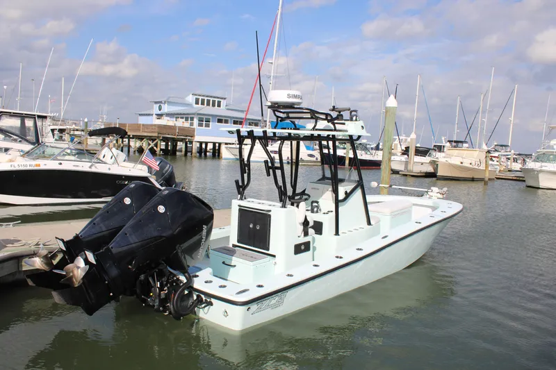 Slide: The Image of 2021 ZCB 26 Freemason boat docked in marina with twin outboard engines. - 0