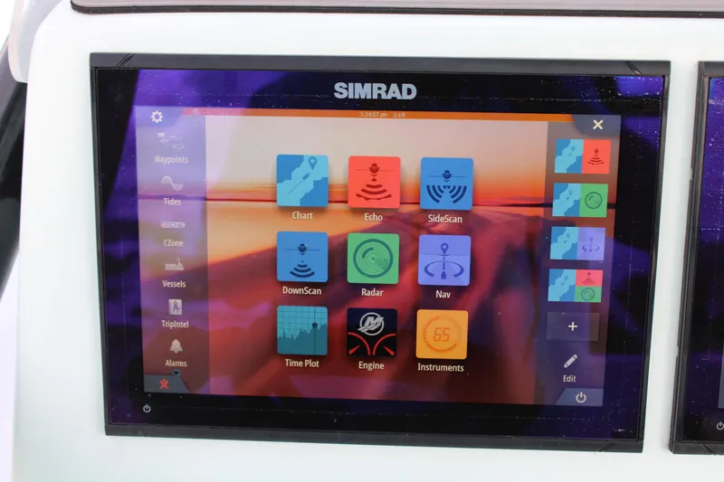 Slide: The Image of Simrad marine navigation display on ZCB 26 Freemason 2021 boat, showing various control icons. - 10