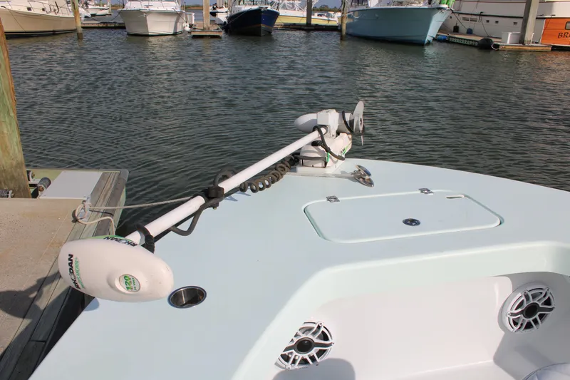 Slide: The Image of ZCB 26 Freemason 2021 boat with trolling motor docked in marina. - 13