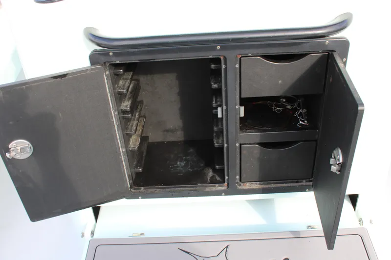 Slide: The Image of Open storage compartments on a 2021 ZCB 26 Freemason boat. - 14