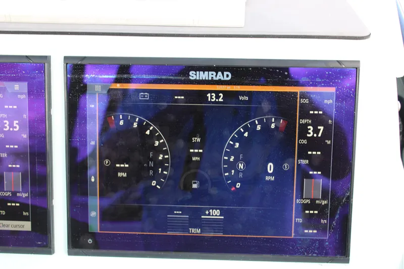 Slide: The Image of Simrad display on ZCB 26 Freemason 2021 showing speed and RPM gauges. - 17