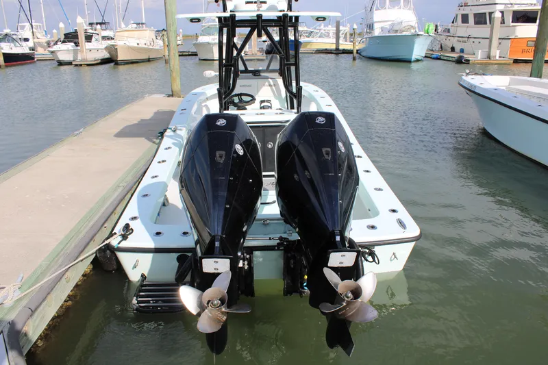 Slide: The Image of 2021 ZCB 26 Freemason boat with dual engines docked at marina. - 2