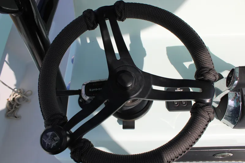 Slide: The Image of Steering wheel of 2021 ZCB 26 Freemason boat, black with rope detail. - 20