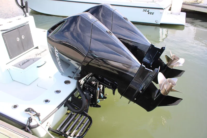 Slide: The Image of Twin Mercury outboard engines on 2021 ZCB 26 Freemason boat in marina. - 22