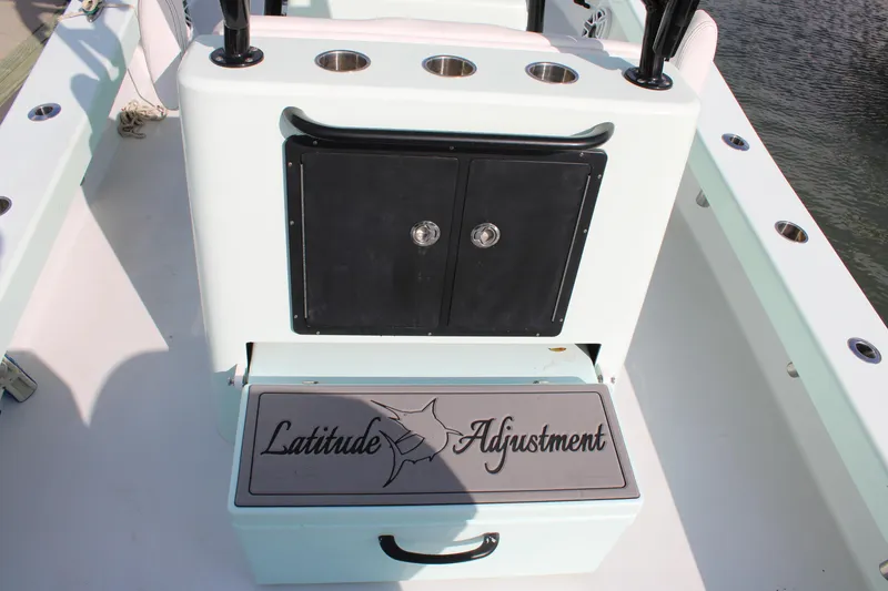 Slide: The Image of ZCB 26 Freemason 2021 boat console with "Latitude Adjustment" seat and storage. - 24
