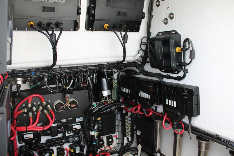 Slide: The Image of Electrical system of a 2021 ZCB 26 Freemason boat with wiring and control panels. - 30