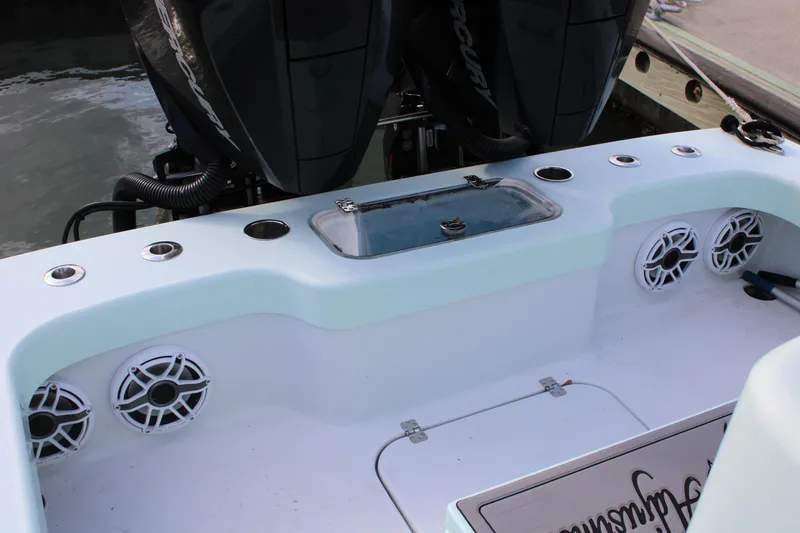 Slide: The Image of ZCB 26 Freemason 2021 boat deck with speakers and dual engines. - 4