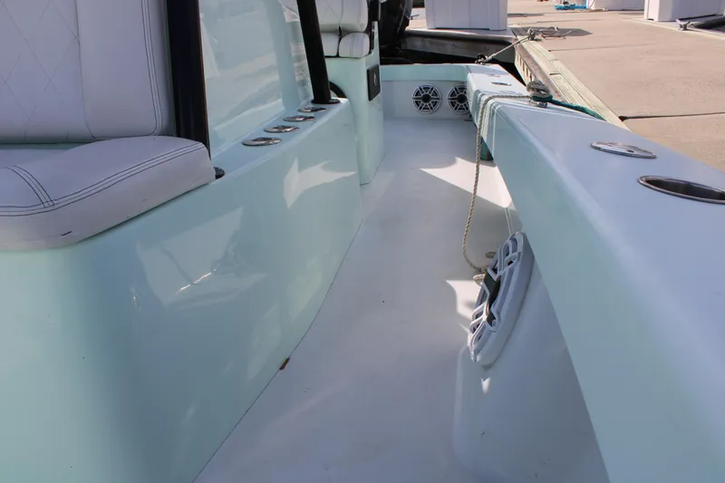 Slide: The Image of 2021 ZCB 26 Freemason boat interior with seating and speakers. - 5