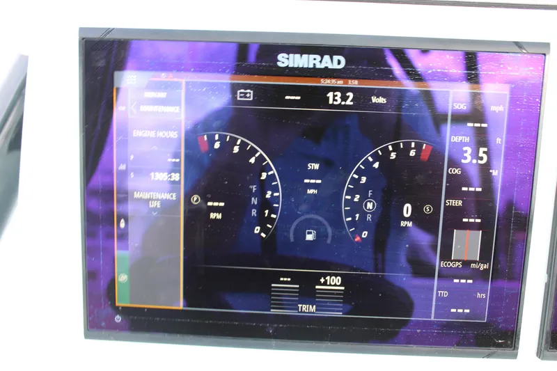 Slide: The Image of Simrad marine display showing engine metrics on ZCB 26 Freemason, 2021 model. - 9