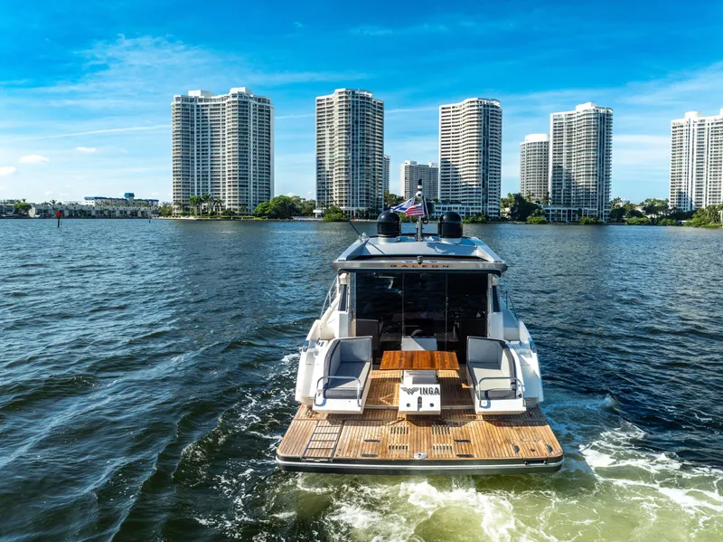 Slide: The Image of Galeon 430 HTC yacht cruising near waterfront skyscrapers, 2016 model. - 13