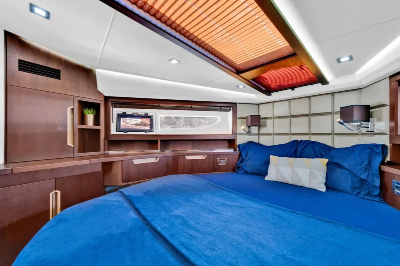 Slide: The Image of Luxurious cabin interior of 2016 Galeon 430 HTC yacht with modern design and blue bedding. - 23