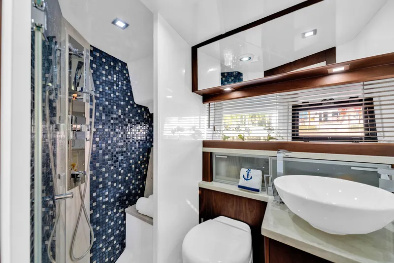 Slide: The Image of Luxurious bathroom in 2016 Galeon 430 HTC yacht with modern fixtures and elegant design. - 25