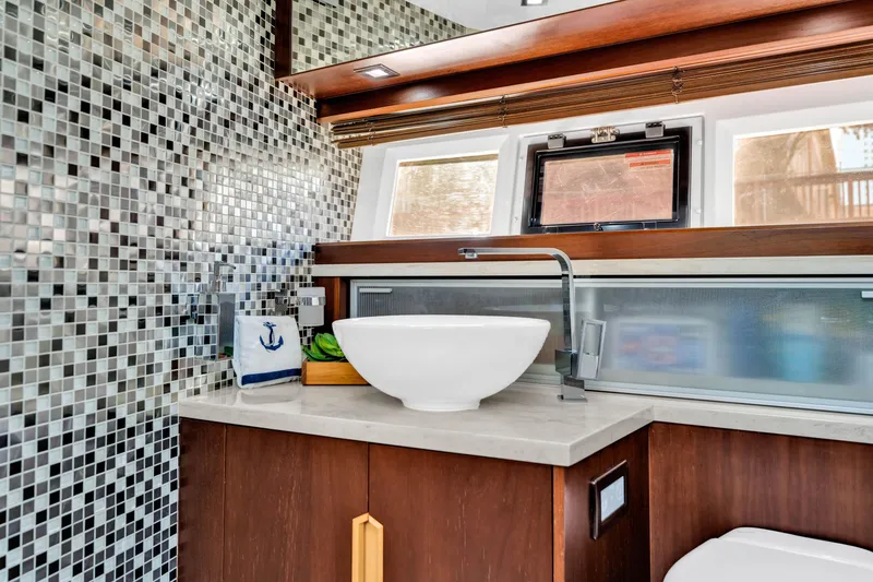 Slide: The Image of Luxurious bathroom in 2016 Galeon 430 HTC yacht with modern sink and mosaic tiles. - 27