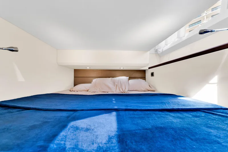 Slide: The Image of Luxurious cabin interior of 2016 Galeon 430 HTC yacht with blue bedding. - 30