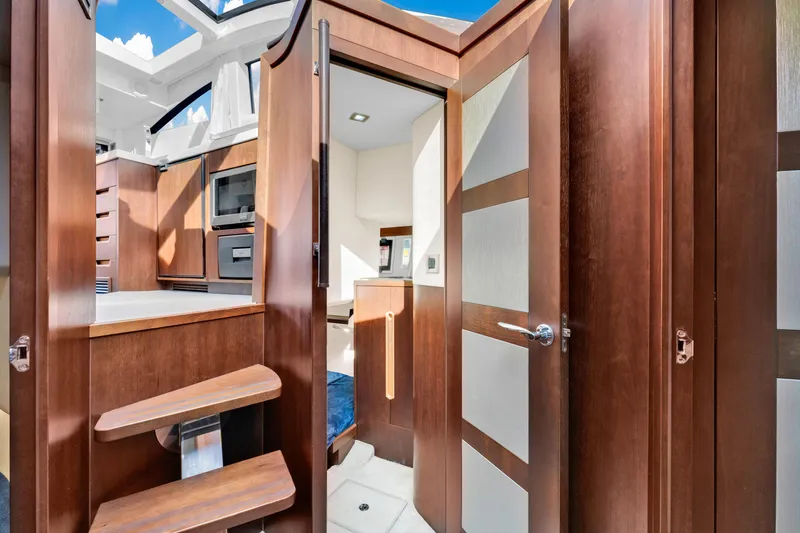 Slide: The Image of Interior of 2016 Galeon 430 HTC yacht with wooden finishes and modern design. - 34
