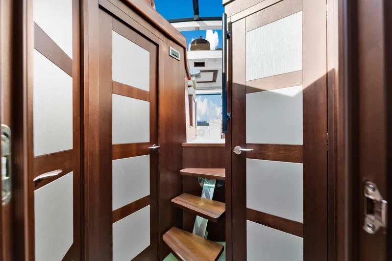 Slide: The Image of Interior of 2016 Galeon 430 HTC yacht with wooden doors and stairs. - 35
