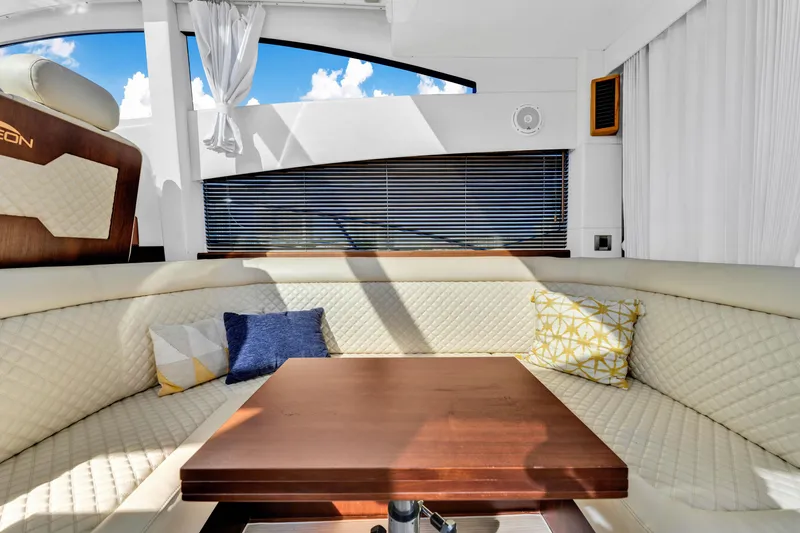 Slide: The Image of Luxurious interior of 2016 Galeon 430 HTC yacht with plush seating and wooden table. - 38
