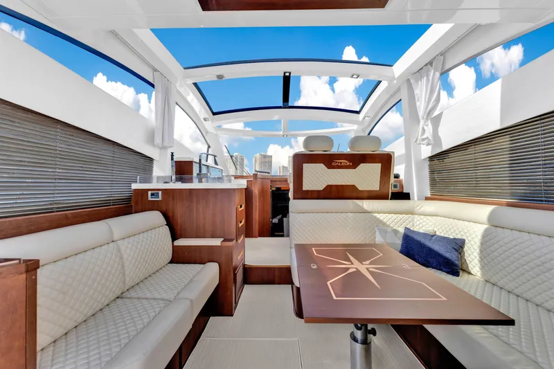 Slide: The Image of Luxurious interior of 2016 Galeon 430 HTC yacht with modern seating and panoramic windows. - 39